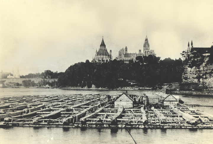 Log drive on Ottawa River with Parliament buildings in background