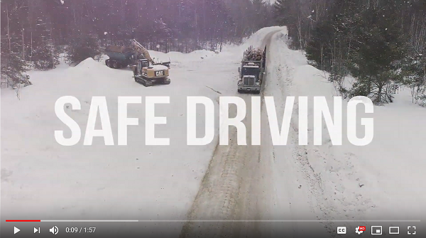 Video screenshot shows logging truck driving down snowy road