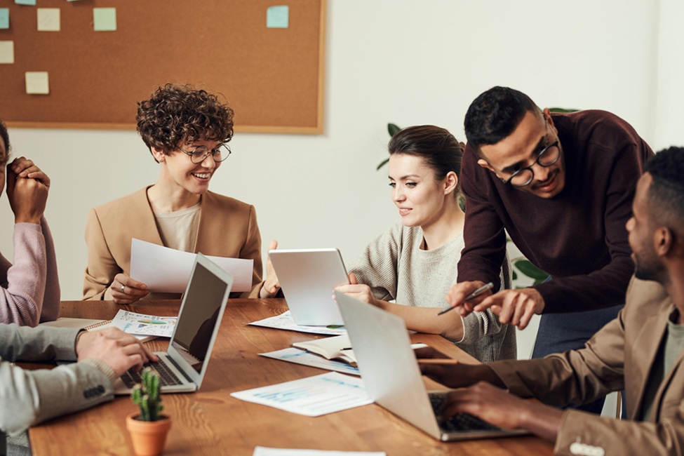 Group of people working together around a table