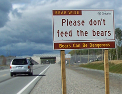 'Please don't feed the bears' highway sign