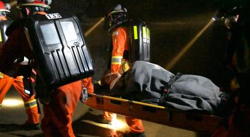 Mine Rescue Officers carrying person